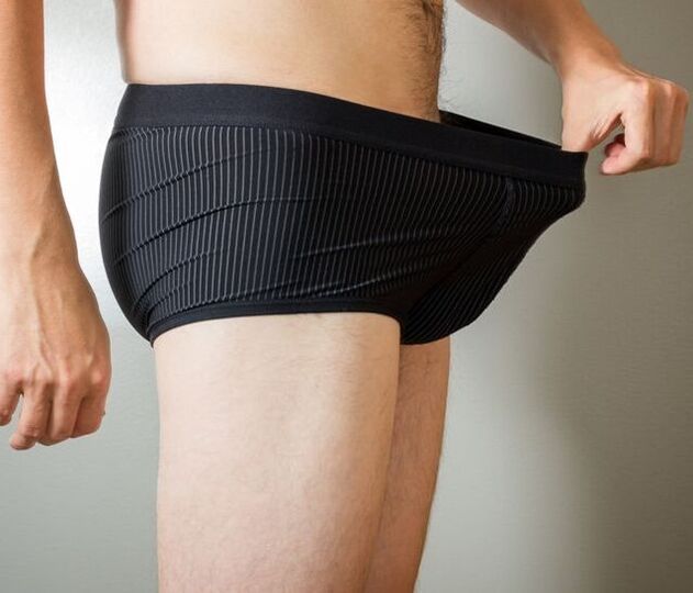man looks in his underwear after penis enlargement surgery